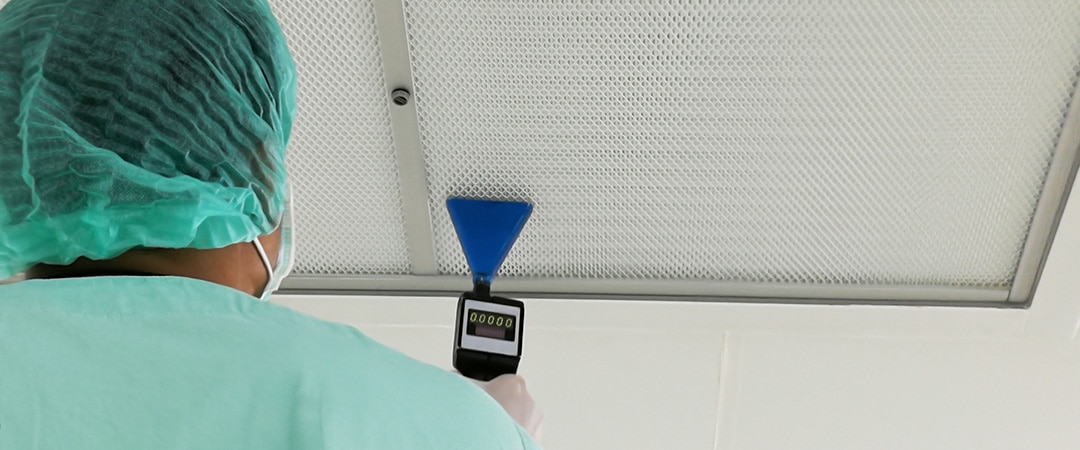 Nurse vacuuming an air vent